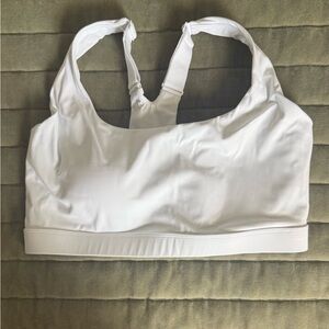 Running Girl white sports bra, sewn in pads, adjustable straps
